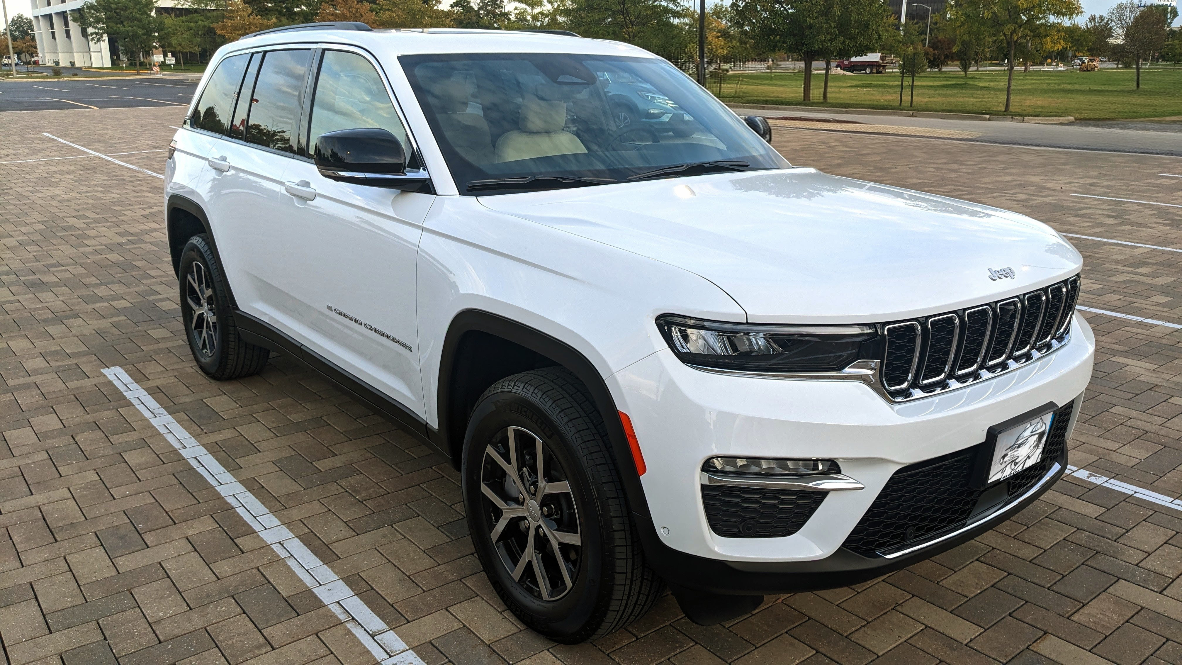 White SUV parked on a Unilock driveway