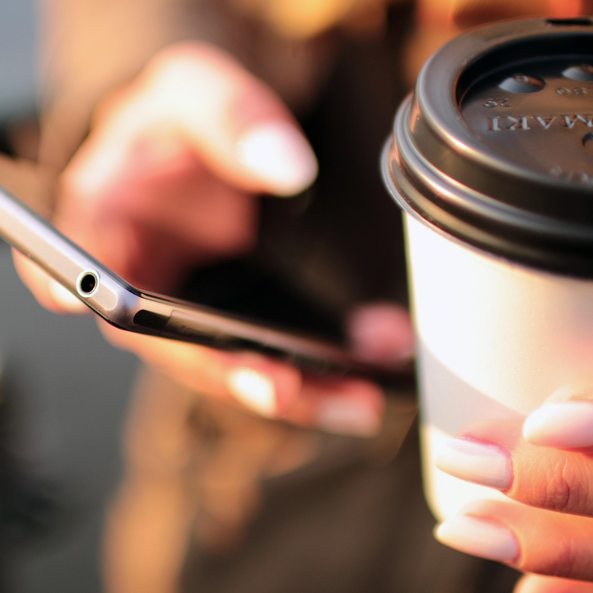 A person holding a handheld device